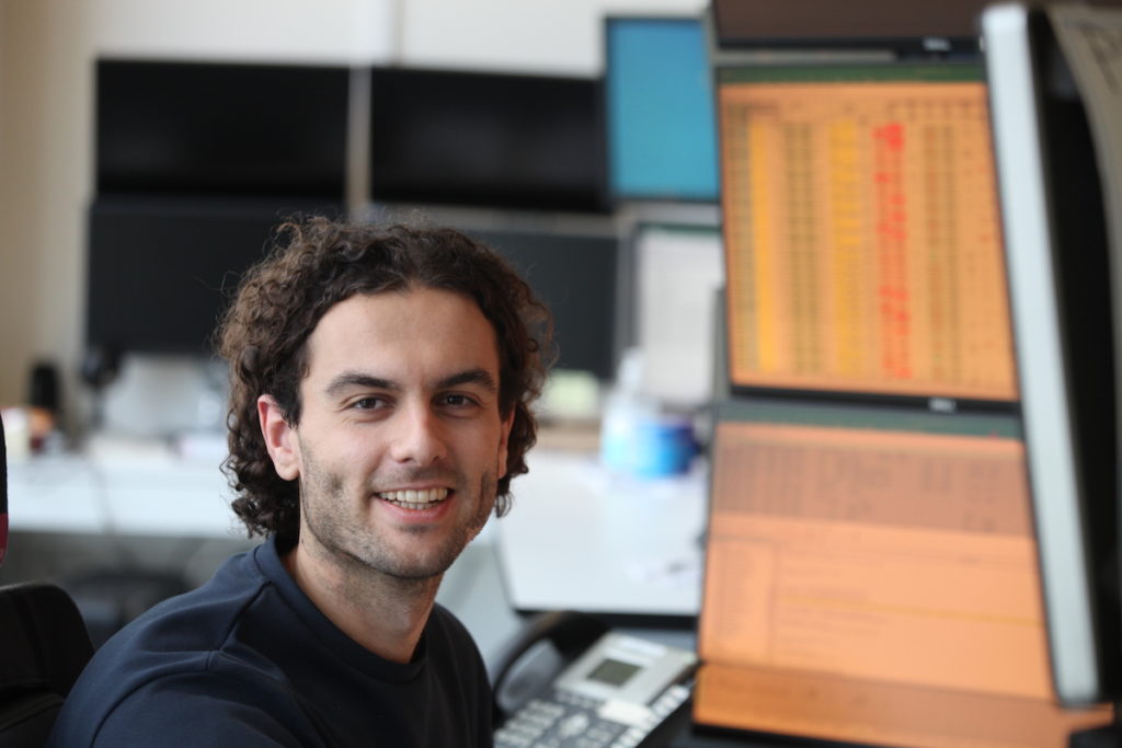 A member of the UTR8 team at their desk